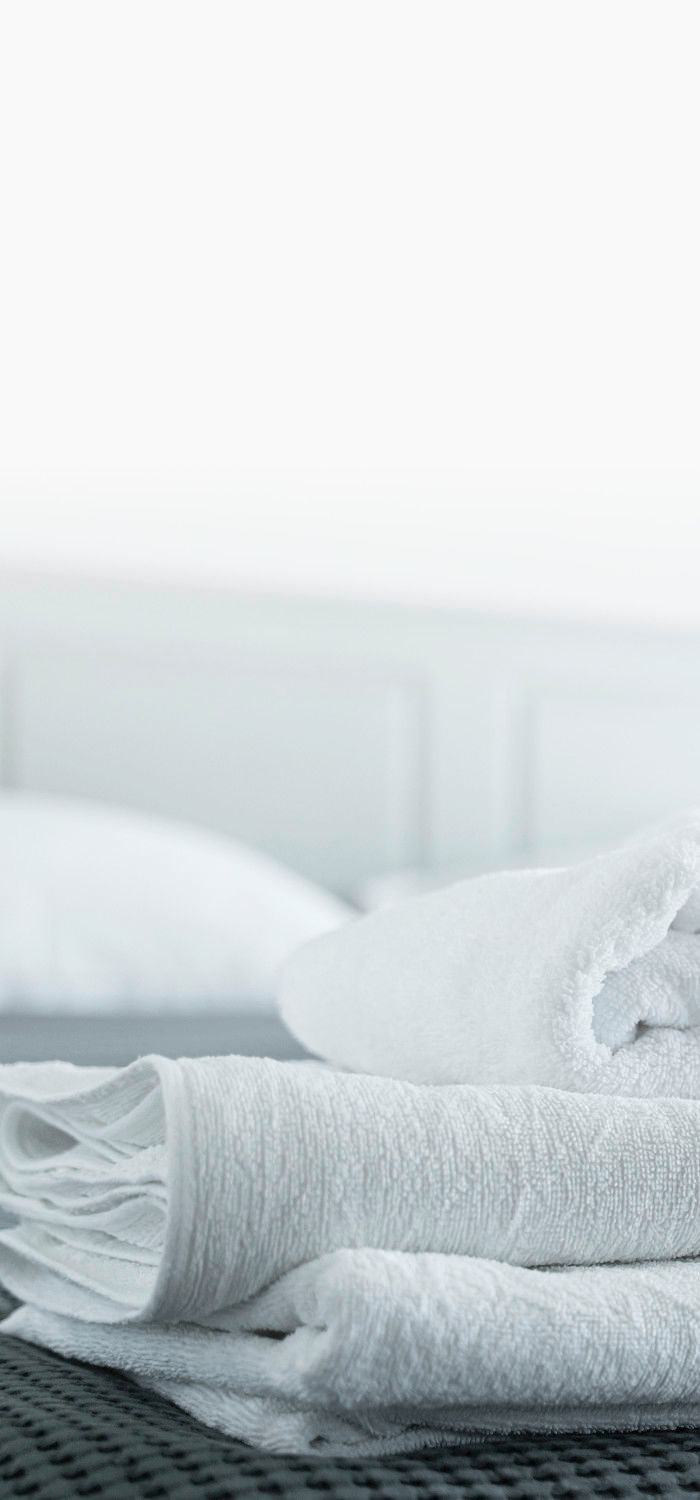 A folded pile of freshly cleaned linens.